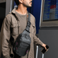 Man wearing On - The - Go Sling Pack in an airport