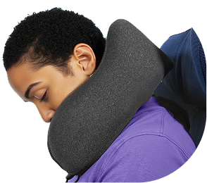 Woman uncomfortable in a competitor travel pillow