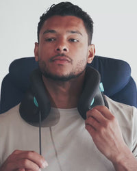 Cinching the adjustable front closure on the Evolution X Neck Pillow